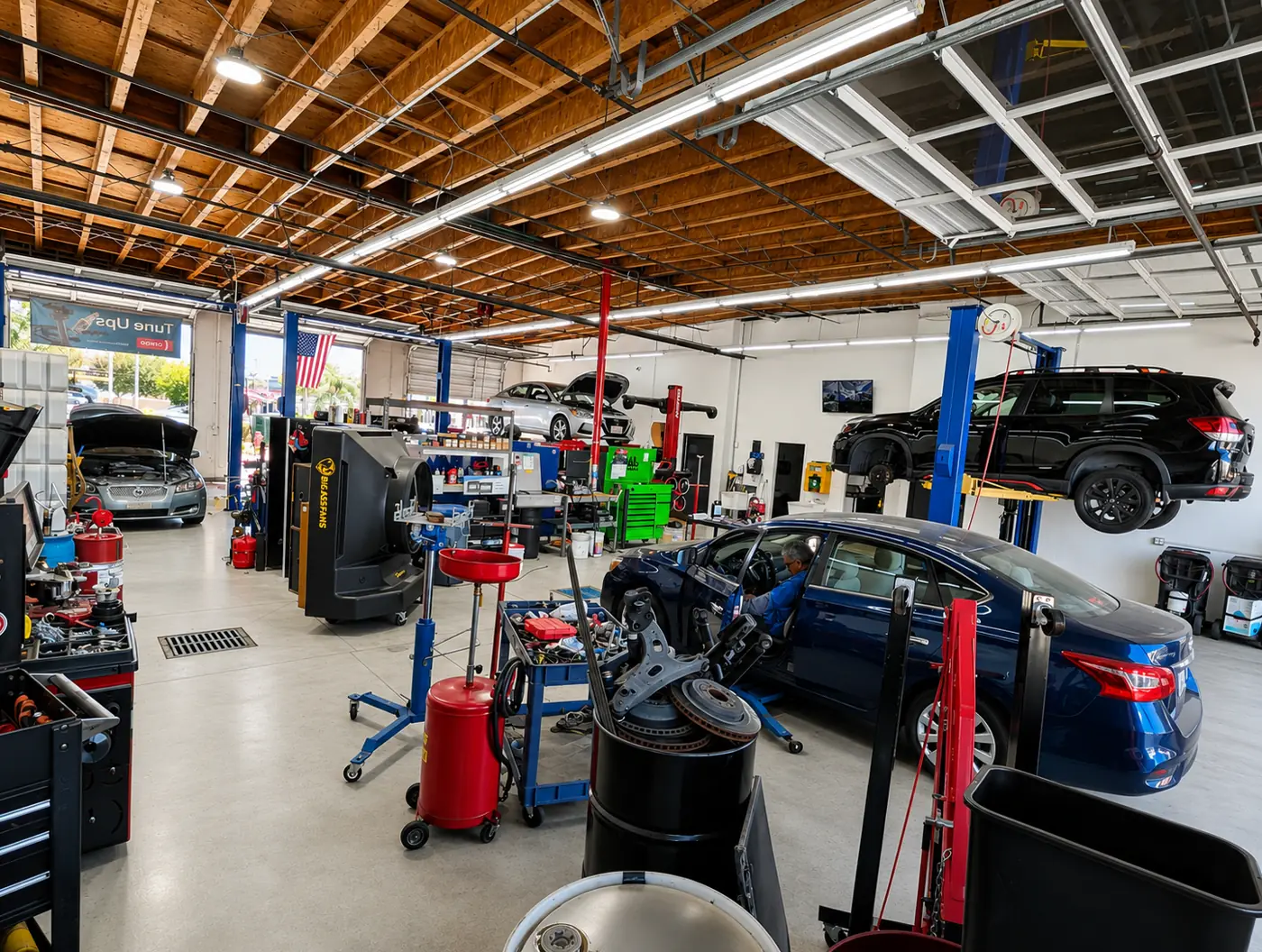 Wide view of the Corona Hills shop floor with vehicles on lifts